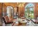 Inviting seating area featuring, leather chairs, accent lighting, and oversized arched windows at , Buford, GA 30518