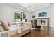 Serene bedroom with large window overlooking pool, fireplace, and chandelier at , Buford, GA 30518