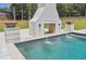 View of backyard pool and fireplace with waterfall features at , Buford, GA 30518