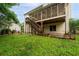 View of the backyard with a covered patio and staircase at 138 Knightwood Pt, Acworth, GA 30101
