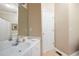 Simple bathroom featuring a single sink vanity, neutral color scheme, and a standard bathtub with shower at 138 Knightwood Pt, Acworth, GA 30101