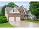 Exterior view of a two-story house with a 2-car garage at 138 Knightwood Pt, Acworth, GA 30101