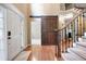 Elegant foyer with hardwood floors, stairs, and a sliding barn door at 138 Knightwood Pt, Acworth, GA 30101
