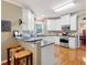 Elegant kitchen with stainless steel appliances, granite countertops, and hardwood floors at 138 Knightwood Pt, Acworth, GA 30101