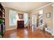 Elegant Living room featuring hardwood floors, fireplace, and stairs to foyer at 138 Knightwood Pt, Acworth, GA 30101