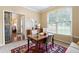 Cozy home office featuring a wooden desk, natural light, and a stylish sliding barn door at 138 Knightwood Pt, Acworth, GA 30101