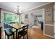 Bright dining area featuring a chandelier, wood table, and sliding glass doors to the backyard at 1769 Milford Creek Sw Cts, Marietta, GA 30008