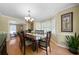 Elegant dining room with hardwood floors, neutral walls, and a view into the living room at 1769 Milford Creek Sw Cts, Marietta, GA 30008