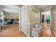 Inviting hallway with hardwood floors, white trim, and views into the living and dining areas at 1769 Milford Creek Sw Cts, Marietta, GA 30008