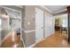 Spacious hallway with hardwood floors and access to the dining room and staircase at 1769 Milford Creek Sw Cts, Marietta, GA 30008