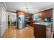 Spacious kitchen with stainless steel appliances, wooden cabinets, and an island with granite countertops at 1769 Milford Creek Sw Cts, Marietta, GA 30008