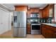 Updated kitchen with wood cabinets, stainless steel appliances, and granite countertops at 1769 Milford Creek Sw Cts, Marietta, GA 30008