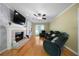 Cozy living room with fireplace, built-in shelves, and hardwood floors at 1769 Milford Creek Sw Cts, Marietta, GA 30008