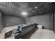 Cozy finished basement featuring carpet flooring, neutral walls, coffered ceiling and recessed lighting at 1887 Chedworth Ct, Stone Mountain, GA 30087
