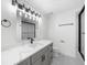 Contemporary bathroom featuring a large vanity, modern sink, and walk-in shower at 1887 Chedworth Ct, Stone Mountain, GA 30087