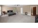 Large bedroom featuring neutral walls, plush carpet, with multiple entry points at 1887 Chedworth Ct, Stone Mountain, GA 30087