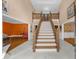 Grand foyer with a beautiful staircase and marble flooring at 1887 Chedworth Ct, Stone Mountain, GA 30087