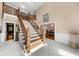 Bright foyer features soaring ceilings and split staircase at 1887 Chedworth Ct, Stone Mountain, GA 30087