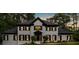 Charming two-story home with a well-manicured lawn and mature trees at 1887 Chedworth Ct, Stone Mountain, GA 30087