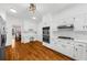 Modern kitchen with white cabinets, stainless appliances, and quartz countertops at 1887 Chedworth Ct, Stone Mountain, GA 30087