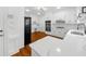 Modern kitchen with white cabinets, stainless appliances, and quartz countertops at 1887 Chedworth Ct, Stone Mountain, GA 30087