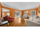 Bright living room featuring hardwood floors and a glimpse of the foyer at 1887 Chedworth Ct, Stone Mountain, GA 30087
