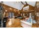 Open living room with hardwood floors, a fireplace, and elegant wood wall paneling at 1887 Chedworth Ct, Stone Mountain, GA 30087