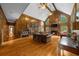 Spacious living room boasts wood paneling, hardwood floors, and a cozy fireplace at 1887 Chedworth Ct, Stone Mountain, GA 30087