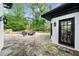 Outdoor patio with stone flooring, outdoor seating and views of the backyard at 1887 Chedworth Ct, Stone Mountain, GA 30087