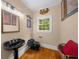 This powder room features a unique black sink and toilet, along with wood flooring at 1887 Chedworth Ct, Stone Mountain, GA 30087