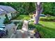 Expansive backyard features a stone patio, manicured lawn, garden, and a glimpse of the inviting swimming pool at 3382 Habersham Rd, Atlanta, GA 30305