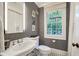 Classic bathroom featuring a pedestal sink, patterned wallpaper, and decorative accents at 3382 Habersham Rd, Atlanta, GA 30305
