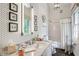 Stylish bathroom with marble vanity, unique fixtures, and decorative wallpaper at 3382 Habersham Rd, Atlanta, GA 30305