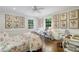 Bright bedroom with hardwood floors, a ceiling fan, lots of wall art, and views of the outdoors at 3382 Habersham Rd, Atlanta, GA 30305
