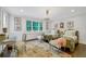 Charming bedroom featuring two twin beds, decorative rug, and large windows at 3382 Habersham Rd, Atlanta, GA 30305