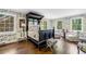 Elegant bedroom with a four poster bed, patterned wallpaper, and natural light at 3382 Habersham Rd, Atlanta, GA 30305
