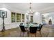 Elegant dining room featuring a chandelier and views to the backyard enhancing the sophisticated ambiance at 3382 Habersham Rd, Atlanta, GA 30305