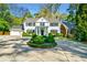Charming two-story home with a circular driveway and manicured landscaping at 3382 Habersham Rd, Atlanta, GA 30305