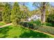 Traditional home with meticulously manicured landscaping, hedges, and a sprawling green lawn at 3382 Habersham Rd, Atlanta, GA 30305