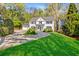 Beautiful two-story home with well-maintained landscaping, circular driveway, and mature trees at 3382 Habersham Rd, Atlanta, GA 30305