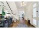 Bright foyer featuring a staircase and hardwood floors, and decorative chest with accents at 3382 Habersham Rd, Atlanta, GA 30305