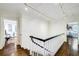Bright hallway with hardwood floors, white walls, and unique lighting at 3382 Habersham Rd, Atlanta, GA 30305