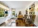 Bright home office with large windows, built-in shelves, and unique zebra print chairs creating a stylish workspace at 3382 Habersham Rd, Atlanta, GA 30305