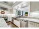 Gourmet kitchen featuring stainless steel appliances, granite countertops, and white cabinets, perfect for culinary enthusiasts at 3382 Habersham Rd, Atlanta, GA 30305