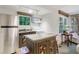 A compact kitchen area with stainless steel appliances and unique cabinetry at 3382 Habersham Rd, Atlanta, GA 30305