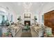Spacious living room with a fireplace, hardwood floors, and modern lighting at 3382 Habersham Rd, Atlanta, GA 30305