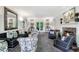 Bright living room with fireplace, elegant furniture, and neutral decor with large mirrors at 3382 Habersham Rd, Atlanta, GA 30305