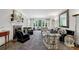 Spacious living room with fireplace, built-in shelving, and large windows offering ample natural light at 3382 Habersham Rd, Atlanta, GA 30305