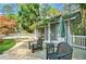 Relax in the charming pool house with outdoor seating overlooking the lush yard and surrounding trees at 3382 Habersham Rd, Atlanta, GA 30305