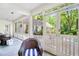 Cozy screened porch with wicker seating and a view of the landscaped backyard at 3382 Habersham Rd, Atlanta, GA 30305